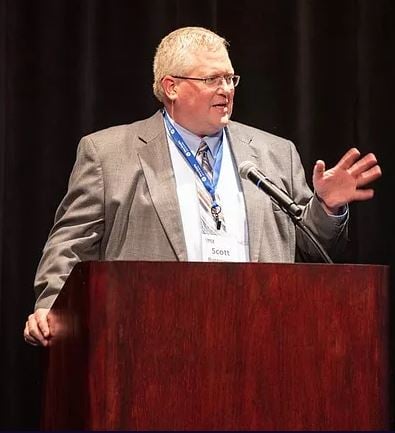 Scott speaking at Baldrige